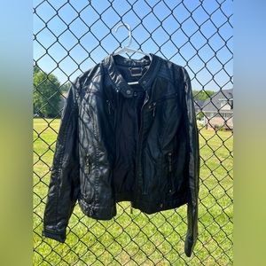 Black leather jacket in size large but fits more like a medium.
